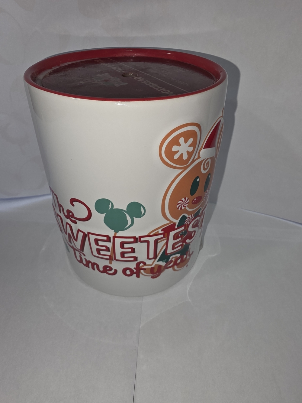 Disney White Ceramic Holiday Treat Candle with Red Rim. Gingerbread